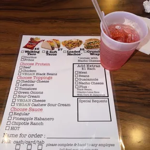 a menu and a drink
