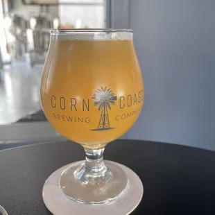 a glass of beer on a table