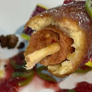 Spicy Beef and Mozzarella Corn Dog -Available starting August 23- bottom half is hotdog tophalf is cheese