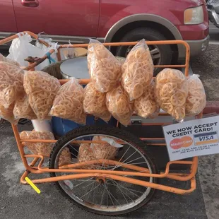 a cart full of corn on the side of the road