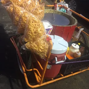 a cart full of noodles and other food items