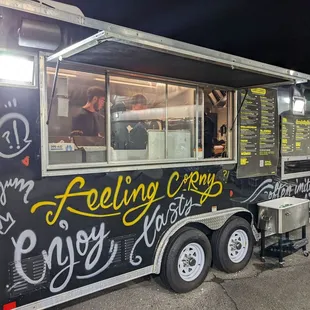 a food truck with writing on it