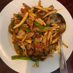 a plate of stir fried food