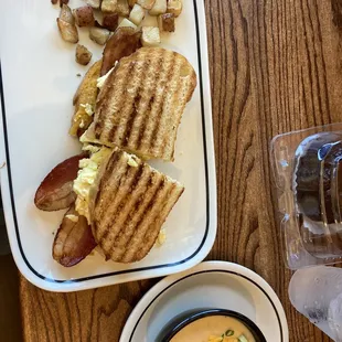 a plate of food and a cup of coffee