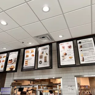 menus on the wall above the counter