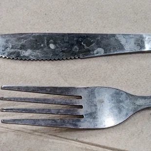 I don't think they know how to wash utensils properly.  Either that or they gave me really old utensils