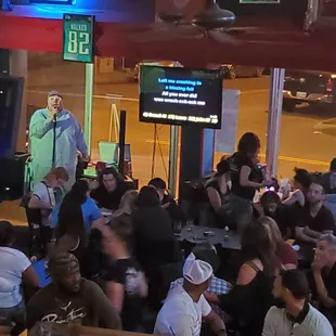 a crowd of people sitting at tables