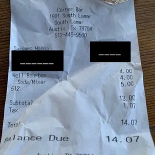 a drink and a receipt on a table