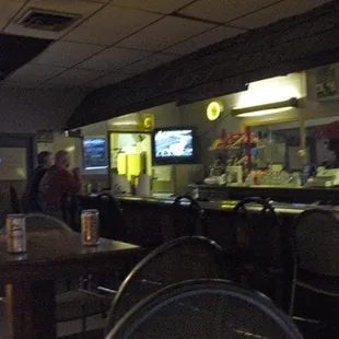 people sitting at tables in a restaurant