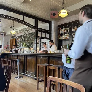 people sitting at tables in a restaurant