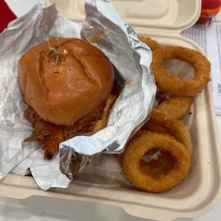 Fried chicken sandwich and onion rings