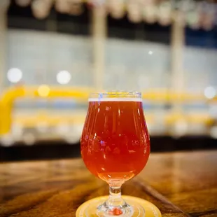 a glass of beer on a table