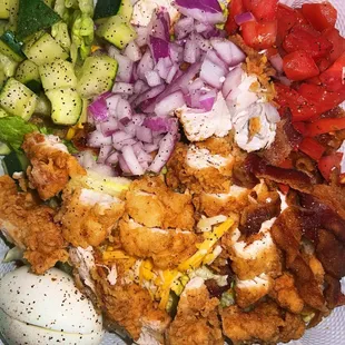 Crispy Popcorn Chicken Salad. Added bacon and eggs, removed bell peppers and had toppings chopped.
