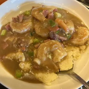 Shrimp and grits ordered as an entrée but it's on the appetizer menu. Delicious.