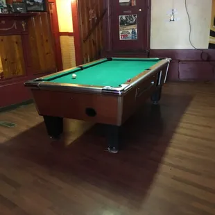 a pool table with a green cloth