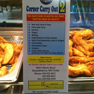 Menu and chicken in the background