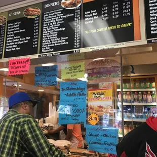a man ordering food at a restaurant