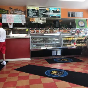a man standing in front of a counter