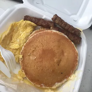 a breakfast of pancakes, eggs, sausages and sausages
