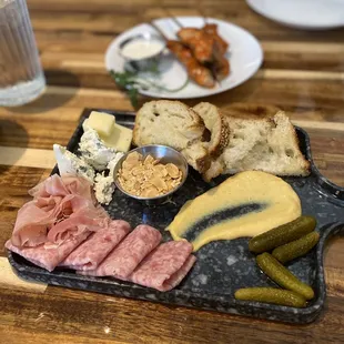 Buffalo Chicken Yakitori in the back and charcuterie board in the front