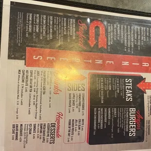 a hand holding a menu