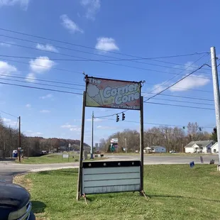 a car parked in front of a sign