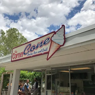 people sitting outside of the corner cone