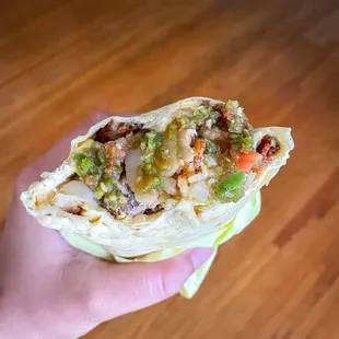 Sausage and Bacon Burrito slathered with a side of salsa