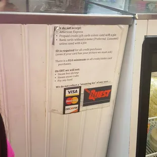 a little boy looking at a refrigerator