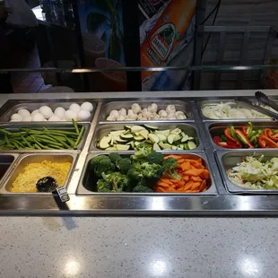 a variety of vegetables in a buffet