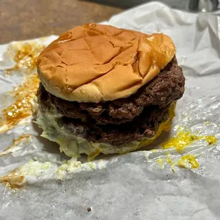 a hamburger on a piece of tin foil