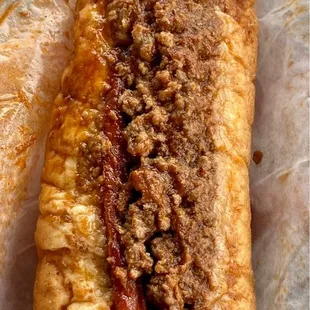 Split and fried hotdog (Van Style) with chili