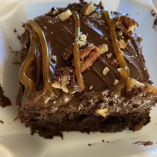 Chocolate cake, chocolate icing, pecans, caramel drizzle, and caramel in the middle. I think I'm going to die!