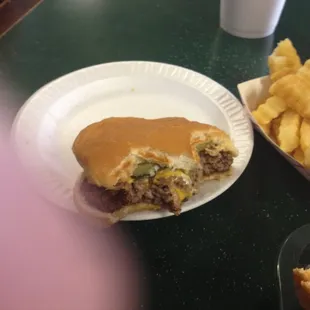 A partially consumed Cheeseburger. Good, greasy, with almost a Velveta type cheese.