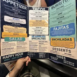 a woman reading a menu