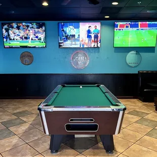 a pool table in a sports bar