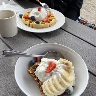 Oat Bake in front &amp; Belgian Waffle with cream, blueberries, and strawberries in back