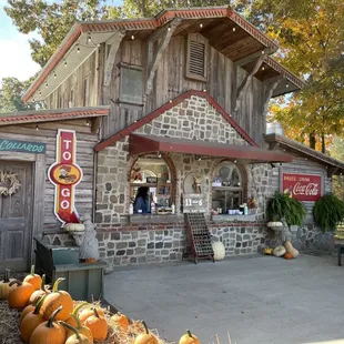 a small brick building with a sign for bbq