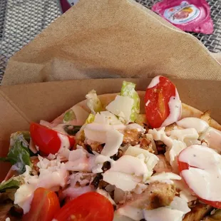 a pizza in a paper bag