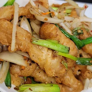 a plate of stir fried food