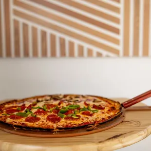 a pizza on a cutting board