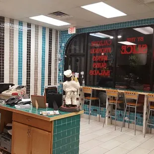 a view of a restaurant with blue tiles