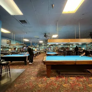 a pool table in the middle of the room