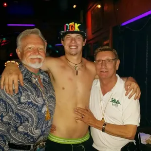 two men and a man with a hat on