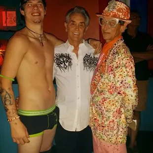 three men in underwear posing for a picture