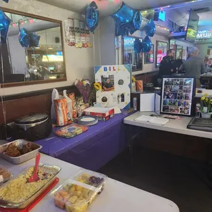 a table with food and balloons