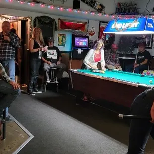 people playing pool in a bar