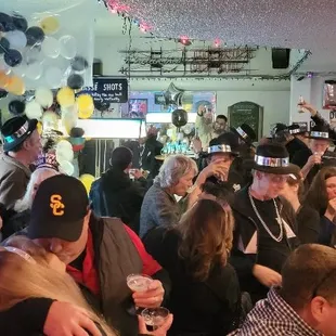 a large group of people at a bar