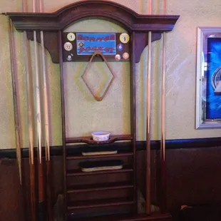 Old style rack in case you don't have you own Cue Stick.