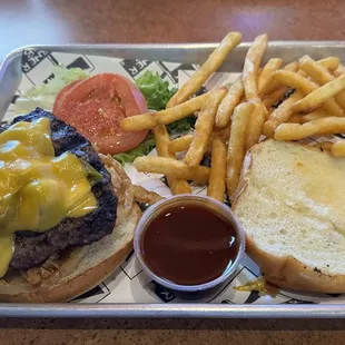 a burger and fries on a tray